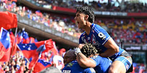 Izack Tago celebrates a try for Samoa.