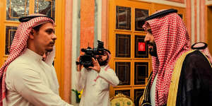 In this photo from the Saudi Press Agency in 2018,the Crown Prince shakes hands with Khashoggi’s son Salah,who was under a travel ban.