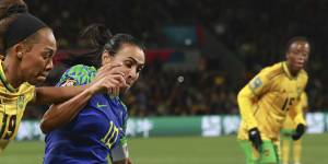 Brazil’s Marta,right,compete for controls the ball with Jamaica’s Tiernny Wiltshire during their 0-0 draw.