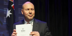 Treasurer Josh Frydenberg with the 2021-22 budget,which forecast a $106.6 billion deficit. Tax concessions contributed to the size of that deficit.