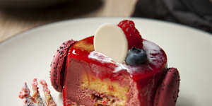 The Goya,a raspberry mousse encasing passionfruit cremeux,nougatine and almong sponge.