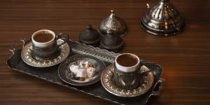Turkish coffee is served in a hand-etched set.