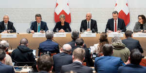 Key figures at a Bern press conference on Sunday (from left):Credit Suisse chairman Axel Lehmann,UBS chairman Colm Kelleher,Swiss Finance Minister Karin Keller-Sutter,Swiss President Alain Berset,Swiss National Bank president Thomas Jordan and Marlene Amstad,the chair of the Swiss Financial Market Supervisory Authority.