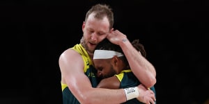 Joe Ingles and Patty Mills hug after winning the bronze medal game in Tokyo. Could they do it again in Paris?