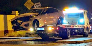 Mr Smith’s car being towed from the crash site on Saturday night.