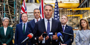 Defence Minister Richard Marles (centre) with (left to right) Foreign Minister Penny Wong,UK Foreign Secretary David Cameron,South Australian Premier Peter Malinauskas and UK Secretary of State for Defence Grant Shapps.