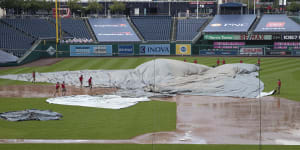 Tangled tarp turns 15-min rain delay into suspended game