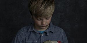 Tom holding one of his prized chickens. 