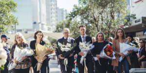 Prime Minister Anthony Albanese and NSW Premier Chris Minns lay flowers with others at Bondi Junction Westfield yesterday.