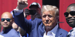 Donald Trump greets supporters at the Iowa Pork Producers tent at the Iowa State Fair on Saturday.