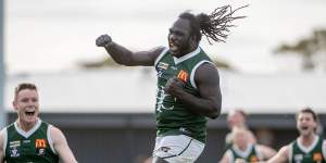 Anthony McDonald-Tipungwuti jumps for joy in Imperials’ premiership win in the Sunraysia Football League.