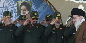 In this picture released by Iran,senior figures from the Revolutionary Guard salute Ayatollah Ali Khamenei.