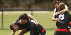 Massimo D’Ambrosio and Will Setterfield wrestle at Essendon training recently.