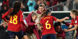 Spanish players celebrate victory in Auckland.