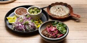 The go-to dish:falling-apart lamb barbacoa served with warm flour tortillas.