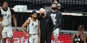 Mills with Gregg Popovich at an NBA game earlier this year. The San Antonio Spurs coach once talked about Eddie Mabo to inspire his players. 