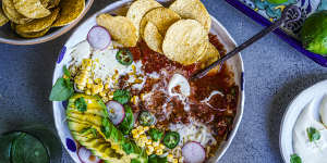 Taco soup with all the toppings.