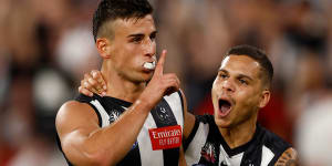 Nick Daicos of the Magpies celebrates a goal.