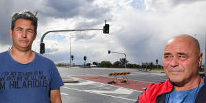Small landowners Paul Coyto and Peter Srzich at the new traffic lights in front of the Leppington Pastoral Company's main entrance.