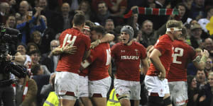 Wales Josh Adams is congratulated by teammates after scoring try during the Six Nations rugby union international between Wales and England at the Principality Stadium in Cardiff,Wales,Saturday,Feb. 23,2019. (AP Photo/Rui Vieira)