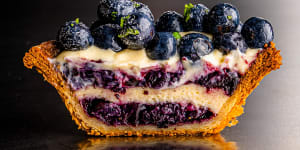 Blueberry tart,with baked cheesecake,blueberry jam,vanilla cream and blueberries.