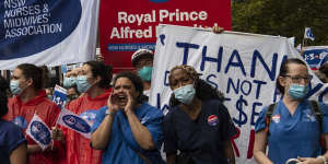 NSW nurses and midwives march to Parliament House on Thursday. 