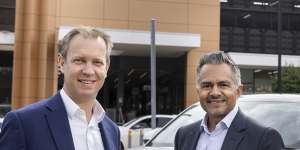 Ampol CEO Matt Halliday (left) and Stockland CEO Tarun Gupta (right) at Stockland Wetherill Park with new the AmpCharge fast charging bay