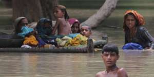 Villagers wade through floodwaters in Rajanpur,Pakistan last month.