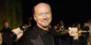 “Crash” writer/director Paul Haggis holds up his two Oscars in 2006.