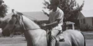 Angelo Costa rides along Warramoo Crescent,Narrabundah,in the early 1960s.