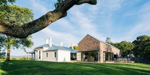 The homestead,just outside Launceston:a glass and steel atrium connects the original 1850s building to its new two-storey extension,which is clad in local brick.