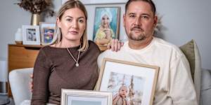 Danielle and Leon Green at home in Western Australia with photos of their children Sonny and Airlie.