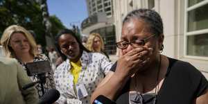 A supporter of R. Kelly cries outside court following the sentencing.