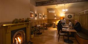 An open fire warms the Courthouse Hotel dining room.