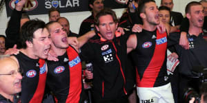 Happier days:James Hird joins in the team song after a big win over Carlton early in his initial tenure as Essendon coach.