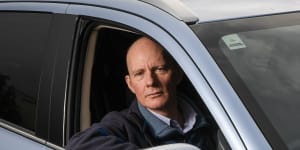 Bruce Gill,hybrid car driver,who is being “double taxed” by having to pay both fuel excise as well as the 2c per km road user charge on his electric vehicle.