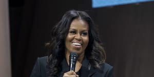 Michelle Obama in Washington wearing a black crystal-embellished suit by Christopher Kane.
