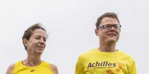 Blind runner Tom Zell and his running partner Cindy Skacel preparing for Sunday’s race.