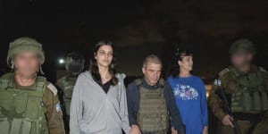 Judith Raanan (right) and her daughter Natalie are escorted by Israeli soldiers as they returned to Israel from captivity in the Gaza Strip.