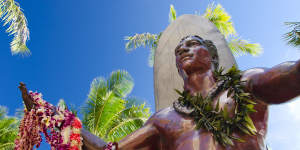 The statue of Duke Kahanamoku,the father of modern surfing,near Waikiki Beach.