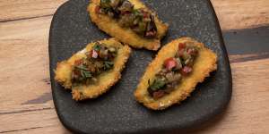 Crumbed butterflied sardines with eggplant caponata.