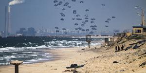 Too little,too late? An airdrop of humanitarian aid over the northern Gaza Strip.