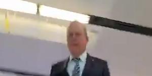 A still from The Australian’s video of an incident between a journalist and Nine Chairman Peter Costello at Canberra Airport.