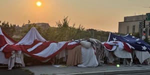 One of the encampments near Foggy Bottom in Washington is notable for the giant,American flag one man uses to protect his belongings.
