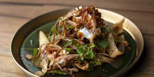 Salad of quail,roasted chilli,banana blossoms and sesame seeds.