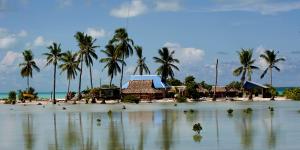 Flooded homes in the village of Taborio on the Tarawa atoll in Kiribati