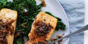 Quick,healthy dinner:Salmon fillets with caramelised onion and wilted greens.