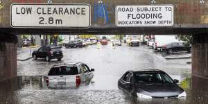 Cars submerged in floodwater at the York Street underpass in South Melbourne. 