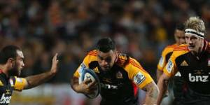 Coming through:Liam Messam of the Chiefs charges with the ball against the Brumbies in the Super Rugby final.