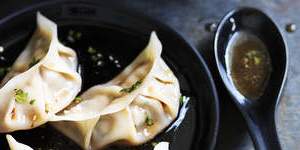 Pork and chive dumplings with red vinegar sauce.